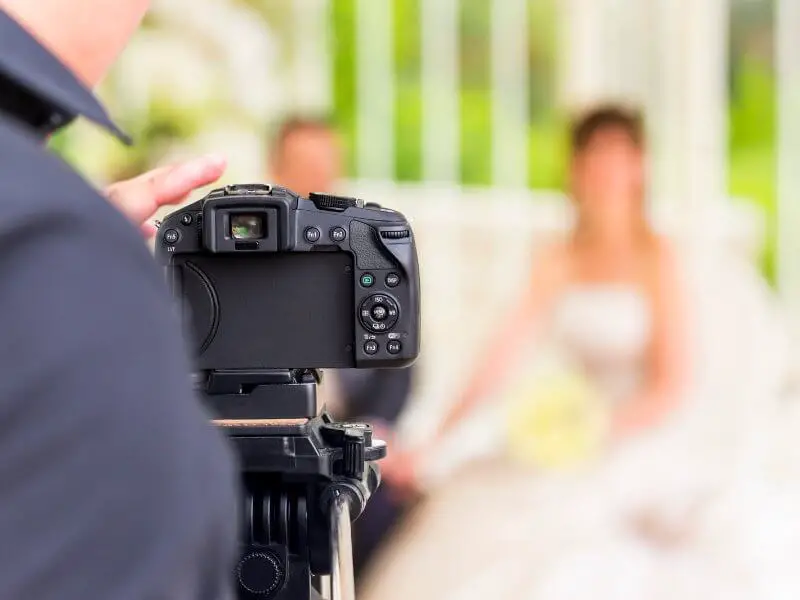 Wedding photographer taking photo of a couple