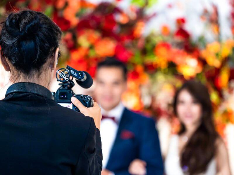 Wedding videography with videographer and couple