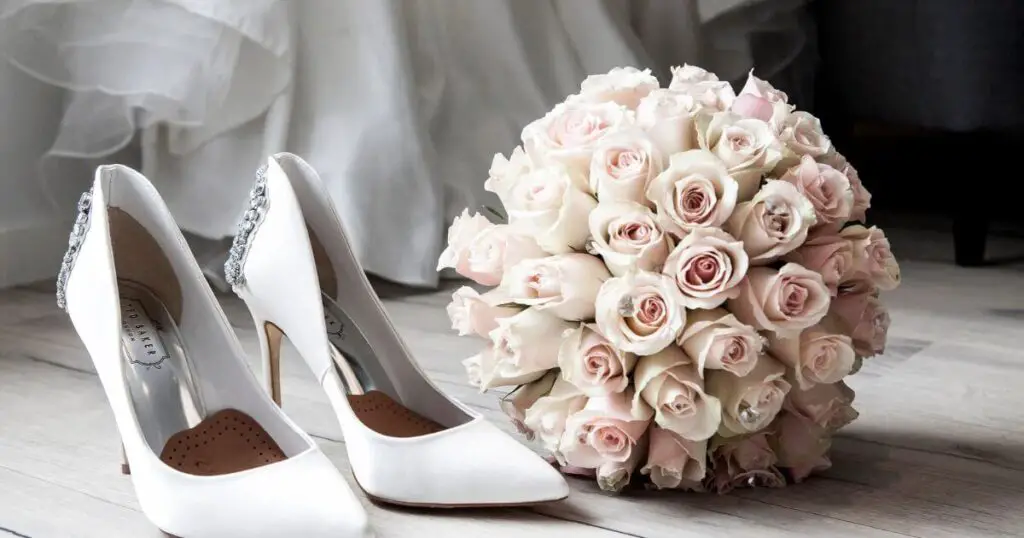 white wedding shoes & flowers