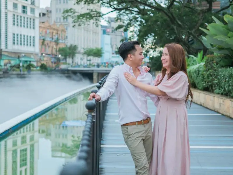 Couple in the city posing for their pre-nuptial photoshoot