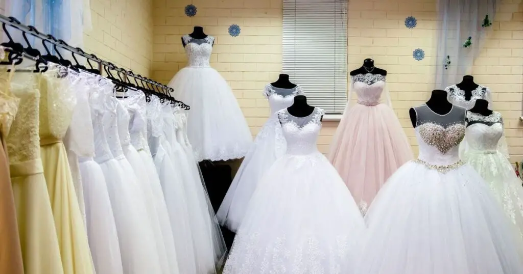 wedding dress design dresses hanging and mannequin