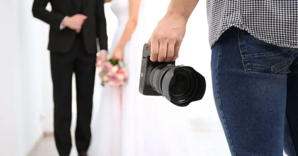 wedding photographers camera bride groom pose
