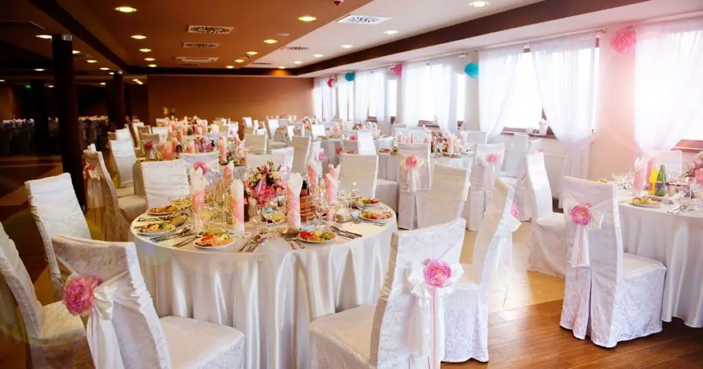 wedding reception hall with tables and chairs