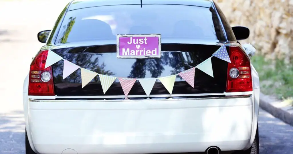 wedding transportation black and white car just married sling