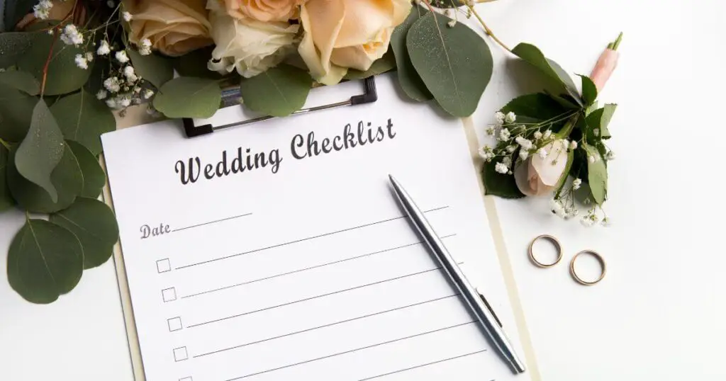 wedding plan paper wedding checklist pen rings flowers